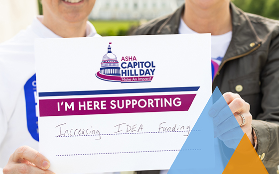 Two members holding a sign that reads: ASHA Capitol Hill Day. I'm here supporting increasing IDEA funding.